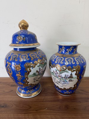Lot 323 - Ginger jar and vase in blue and gilt with...