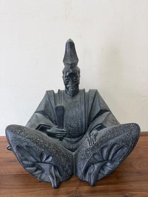Lot 613 - Large carved sculpture depicts a seated figure...