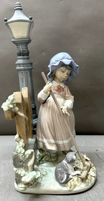 Lot 327 - Lladro 'Fall Clean up' porcelain figure,...