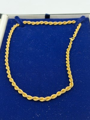 Lot 571 - A 9ct gold rope necklace with a drop of...