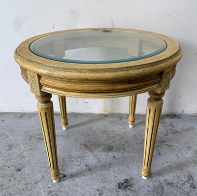 Lot 132 - A Louis style glass topped circular side table...
