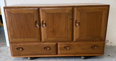 Lot 158 - A blonde Ercol sideboard conprising of three...