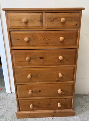 Lot 81 - A pine tall boy comprising of two short...