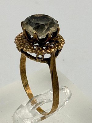 Lot 532 - A 9ct gold smokey quartz cocktail ring,...