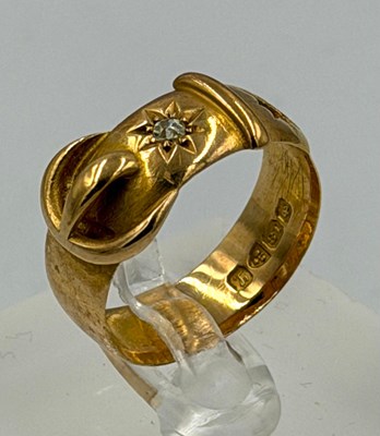 Lot 542 - An 18ct gold belt themed ring, missing stone,...