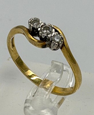 Lot 539 - An 18ct gold three stone diamond ring, in...