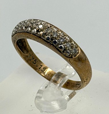 Lot 533 - A 9ct gold pave set white stone ring...