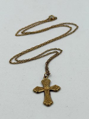 Lot 528 - A 9ct gold cross on a fine chain with...