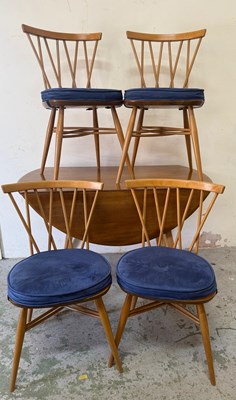 Lot 190 - An Ercol drop leaf dining table and four...