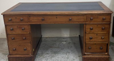 Lot 167 - A light oak pedestal desk with blue tooled...