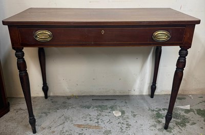 Lot 85 - A mahogany two drawer side table on turned...