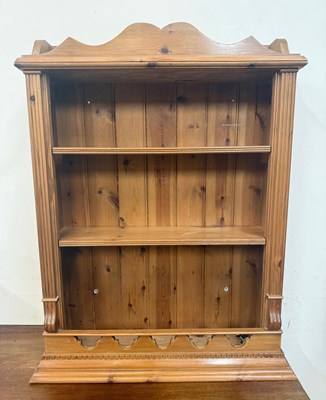 Lot 86 - A pine two shelf wall hanging bookcase. Height...