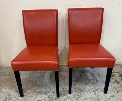 Lot 34 - A four brown faux leather dining chairs