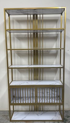 Lot 121 - A contemporary line bookshelf with gold metal...