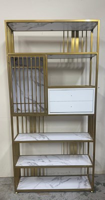 Lot 15 - A contemporary line bookshelf with gold metal...
