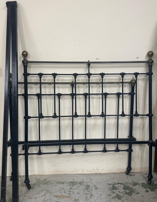 Lot 74 - A black wrought iron bed with sprung base....