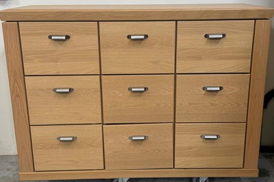 Lot 169 - A contemporary light oak merchants chest...