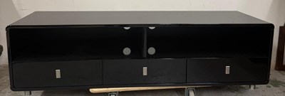 Lot 431B - A black gloss media unit with three drawers...