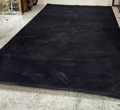 Lot 428 - A large black rug wih pipped edging 360cm x 210cm