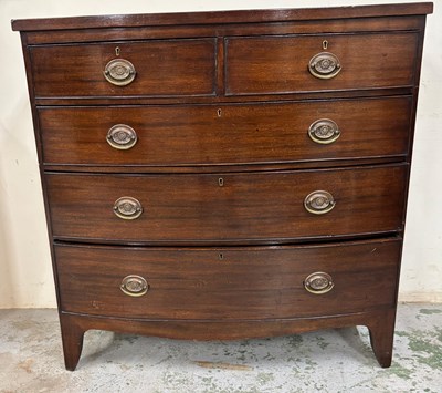 Lot 172 - A bow fronted chest in mahogany features five...