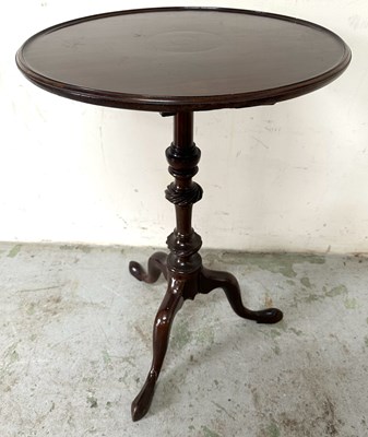Lot 45 - A mahogany drop leaf side table on central...