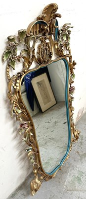 Lot 46 - A Rococco style wall mirror with a gold and...