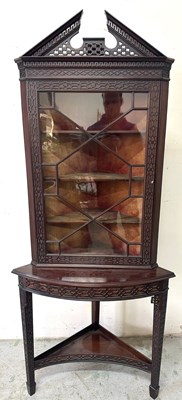 Lot 65 - An antique mahogany corner display cabinet in...