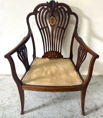 Lot 66 - A mahogany salon chair faeturing a distinetive...