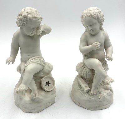Lot 736 - A pair of porcelain figurines depicting two...