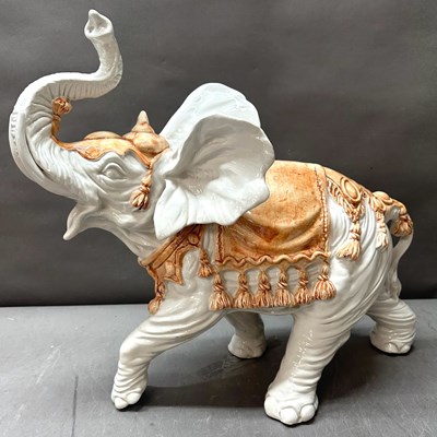 Lot 738 - A decorative elephant sculpture featuring hand...