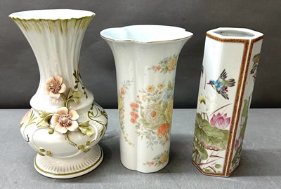Lot 739 - A trio of procelain vases with floral decoration