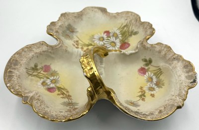 Lot 744 - A limoges procelain serving dish with a hand...