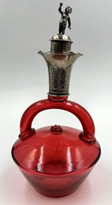 Lot 508 - An antique cranberry glass decanter with a...
