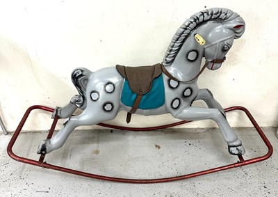 Lot 657 - A vintage rocking horse on a red steel frame