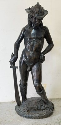 Lot 614 - A filled resin sculpture of David, holding a...