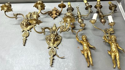 Lot 394 - A selection of gilt bronze and brass candle...
