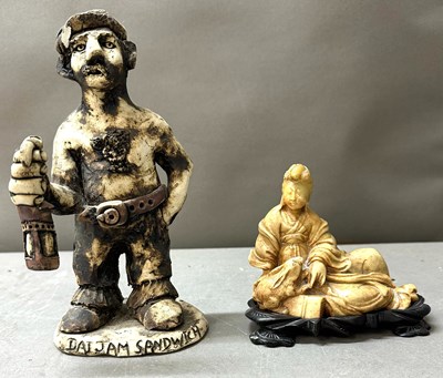 Lot 754 - A ceramic figurine of a Welsh pottery Crogg...