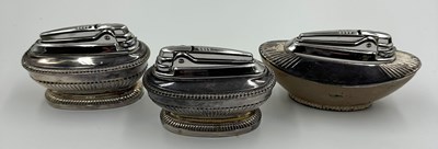 Lot 507 - A trio of Ronson silver plated table lighters