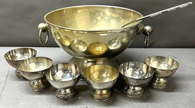 Lot 506 - A silverplate ounch bowl set featuring the...