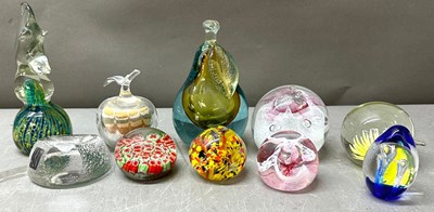 Lot 758 - A selection of glass paperweights in various...