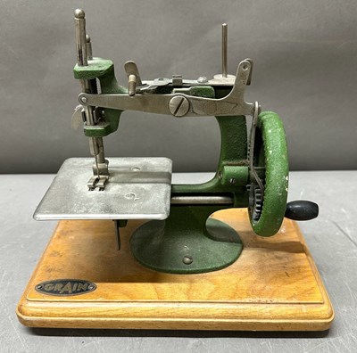 Lot 648 - A vintage E.L Grain miniature childrens sewing...