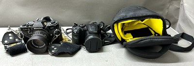 Lot 844 - A pair of digital cameras to include a Mamiya...