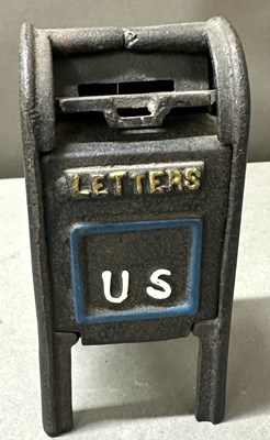 Lot 713 - A money box in the shape of a United Sates...