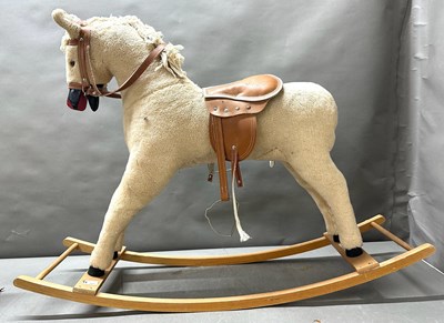 Lot 649 - A vintage rocking horse with a simulated...