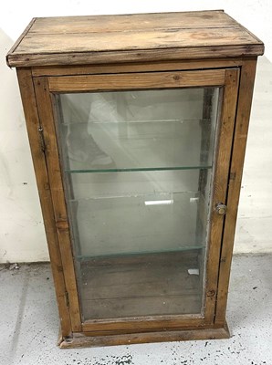 Lot 126 - A vintage shop display cabinet with glass door...