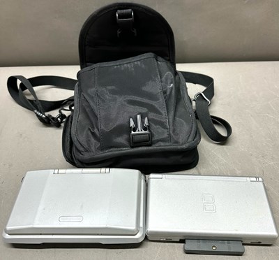 Lot 847 - Two Nintend DS games console and games
