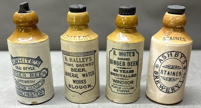 Lot 848 - Four antique stoneware ginmger beer bottles...