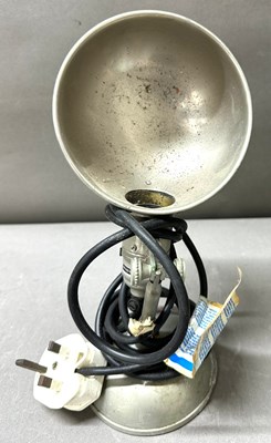 Lot 731 - An antique spot lamp with dome shaped metallic...