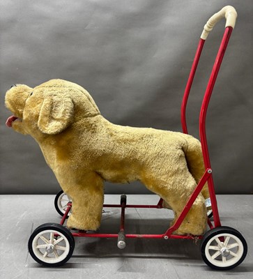 Lot 785 - A vintage push along dog