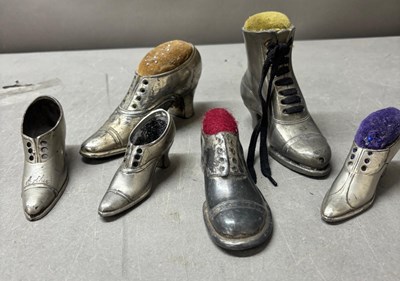 Lot 787 - Six shoe pin cushions